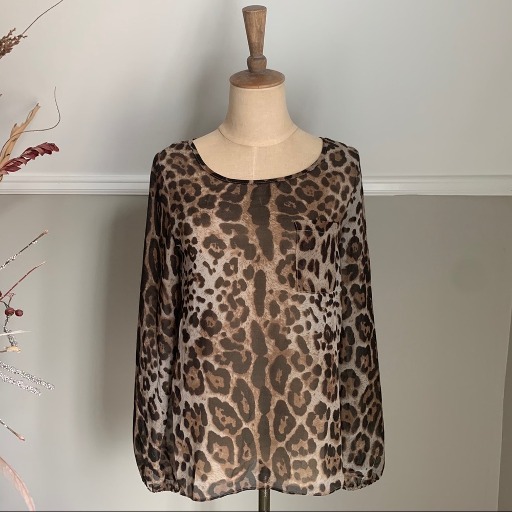 Cheetah print sheer long sleeve tulip back blouse